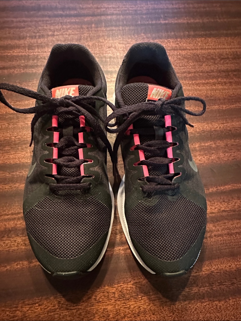 Nike Women's Black Running Sneakers with Pink Accents